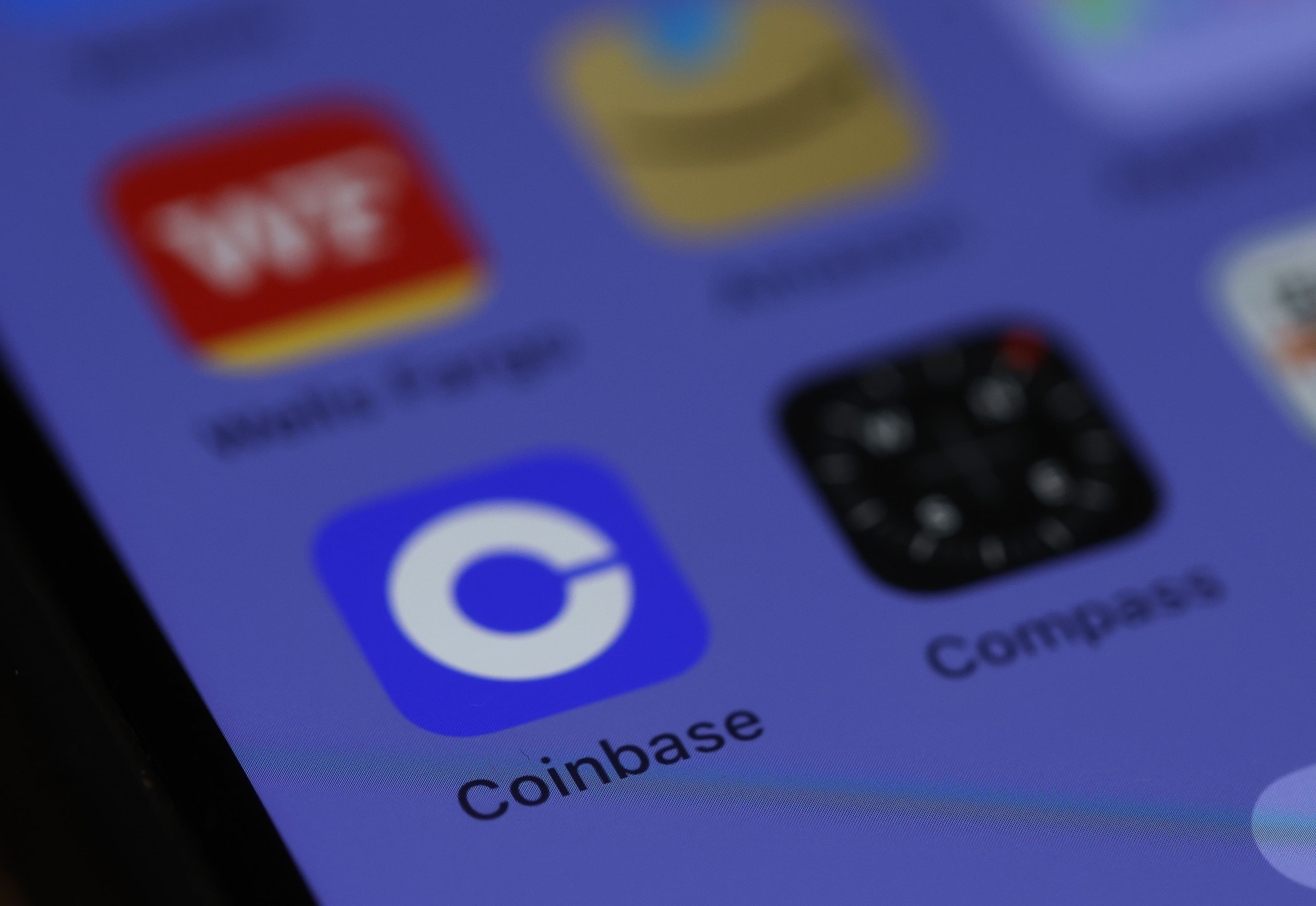 Coinbase app on a mobile phone screen.